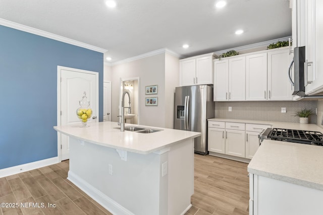 121 Thistleton Way, Saint Augustine, FL 32092 - kitchen featuring stainless steel appliances, a sink, recessed lighting, crown molding, and an island with sink