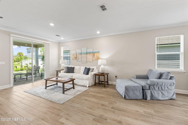 121 Thistleton Way, Saint Augustine, FL 32092 - living room with ornamental molding, light wood finished floors, baseboards, and recessed lighting