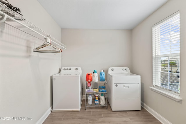 121 Thistleton Way, Saint Augustine, FL 32092 - laundry room featuring independent washer and dryer, wood finish floors, and baseboards