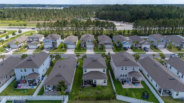 121 Thistleton Way, Saint Augustine, FL 32092 - aerial perspective of suburban area with a heavily wooded area