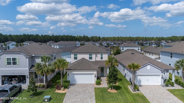 121 Thistleton Way, Saint Augustine, FL 32092 - traditional-style house with a residential view, driveway, a front lawn, and an attached garage