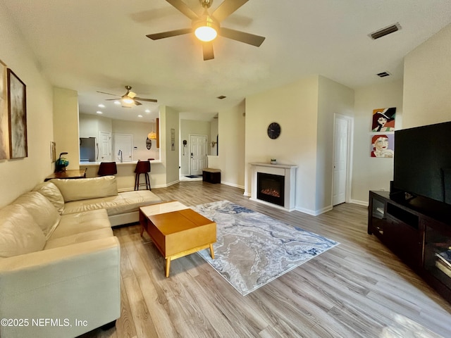 12301 Kernan Forest Blvd Unit 1905, Jacksonville, FL 32225 - living room with ceiling fan, light wood-style flooring, baseboards, and recessed lighting