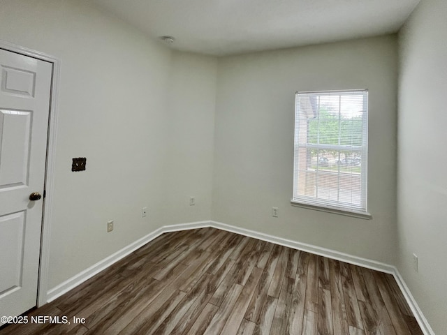 12301 Kernan Forest Blvd Unit 1905, Jacksonville, FL 32225 - spare room featuring dark wood-style floors, baseboards, and a smoke detector