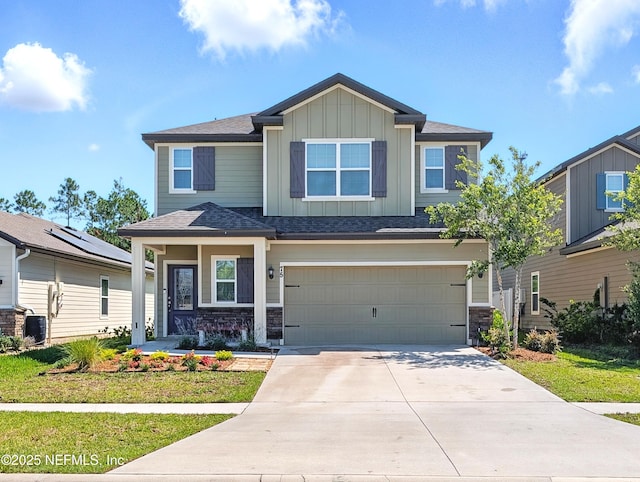 75 Brybar Dr, Saint Augustine, FL 32095 - craftsman-style house featuring board and batten siding, an attached garage, driveway, stone siding, and roof with shingles