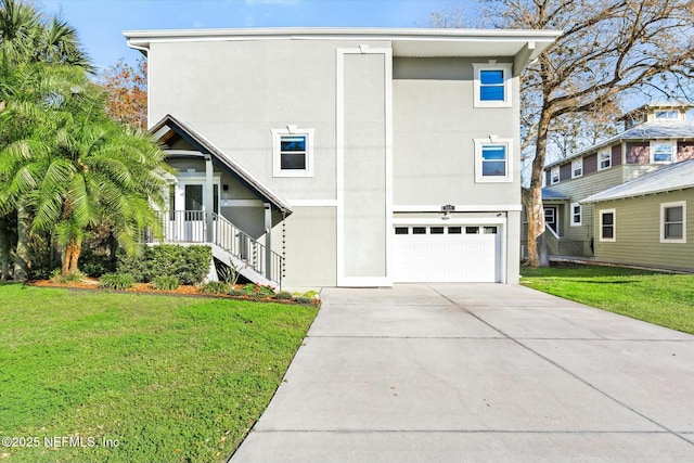 415 Seminole Rd, Atlantic Beach, FL 32233 - view of front facade featuring stucco siding, an attached garage, a front yard, and driveway