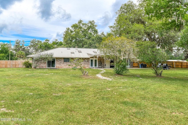 122 Raintree Woods Trl, Palatka, FL 32177 - rear view of house featuring metal roof