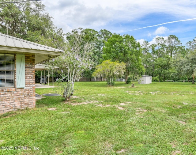 122 Raintree Woods Trl, Palatka, FL 32177 - view of green lawn featuring view of wooded area