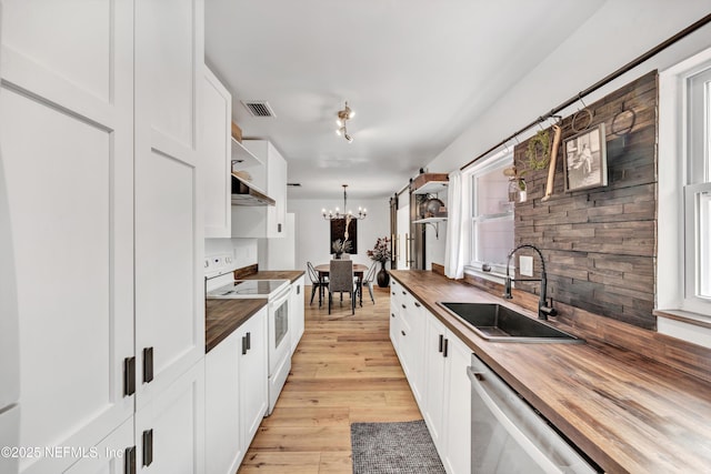 822 Valnera Ct, Saint Augustine, FL 32086 - kitchen with butcher block counters, a sink, open shelves, white range with electric cooktop, and a chandelier