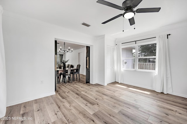 822 Valnera Ct, Saint Augustine, FL 32086 - unfurnished room featuring a chandelier, crown molding, light wood-style flooring, a ceiling fan, and baseboards