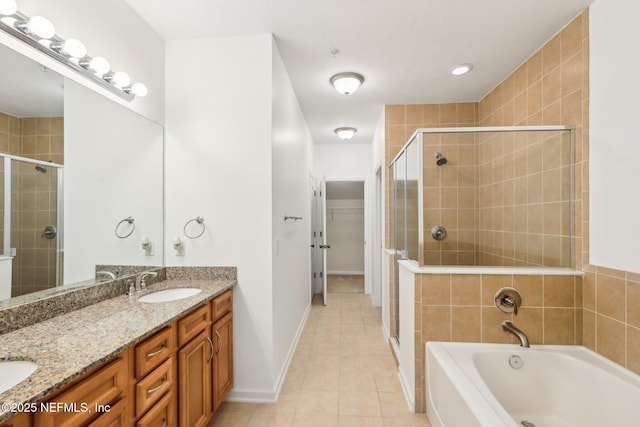 215 Bayberry Cir Unit 605, Saint Augustine, FL 32086 - full bath featuring a shower stall, double vanity, a garden tub, tile patterned floors, and a spacious closet