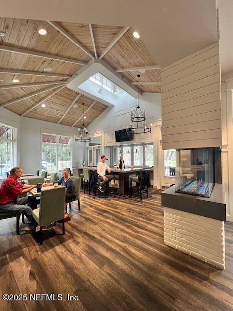 1829 Turtle Dunes Pl Unit 1829, Fernandina Beach, FL 32034 - dining area with wood finished floors, high vaulted ceiling, a chandelier, wooden ceiling with exposed beams, and plenty of natural light