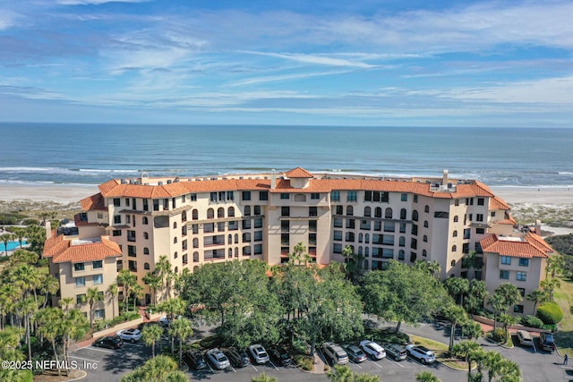 1829 Turtle Dunes Pl Unit 1829, Fernandina Beach, FL 32034 - view of apartment building / complex with view of water and beach and uncovered parking