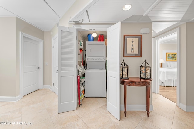 1829 Turtle Dunes Pl Unit 1829, Fernandina Beach, FL 32034 - hallway with stacked washer / dryer, light tile patterned floors, and baseboards