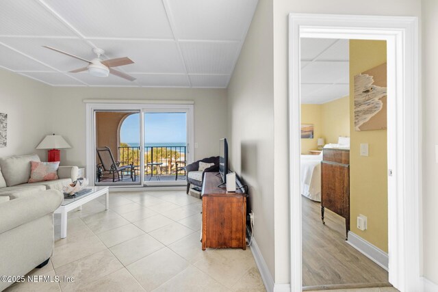 1829 Turtle Dunes Pl Unit 1829, Fernandina Beach, FL 32034 - living area with ceiling fan, baseboards, and light tile patterned floors
