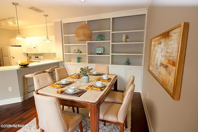 520 Florida Club Blvd Unit 202, Saint Augustine, FL 32084 - dining area with dark wood-style floors and baseboards