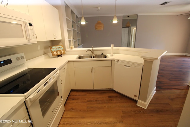 520 Florida Club Blvd Unit 202, Saint Augustine, FL 32084 - kitchen featuring white appliances, a sink, ornamental molding, a peninsula, and light countertops