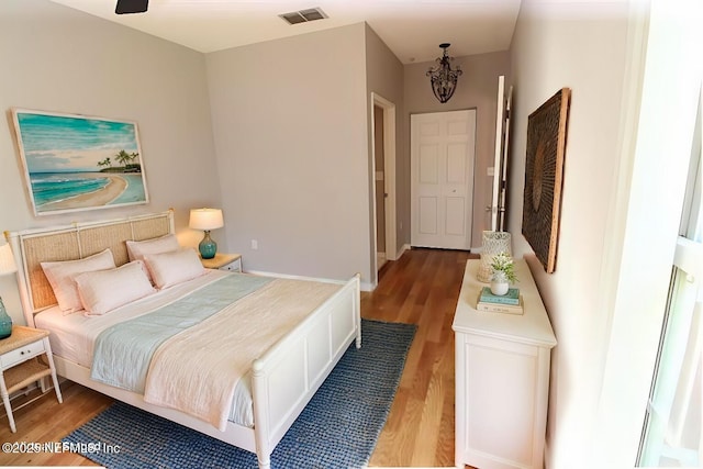 520 Florida Club Blvd Unit 202, Saint Augustine, FL 32084 - bedroom with light wood-style floors and a chandelier