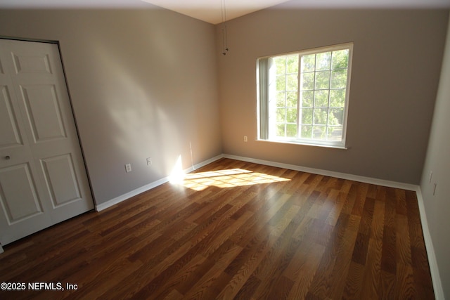 520 Florida Club Blvd Unit 202, Saint Augustine, FL 32084 - unfurnished room featuring baseboards and dark wood finished floors