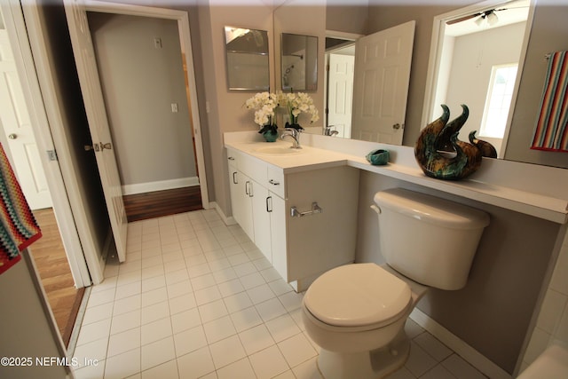 520 Florida Club Blvd Unit 202, Saint Augustine, FL 32084 - bathroom featuring toilet, vanity, tile patterned floors, and baseboards