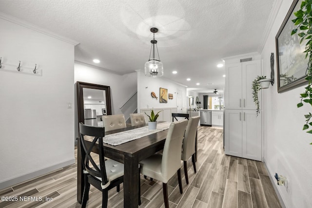 5811 Atlantic Blvd Unit 153, Jacksonville, FL 32207 - dining space with ornamental molding, light wood finished floors, a textured ceiling, recessed lighting, and baseboards
