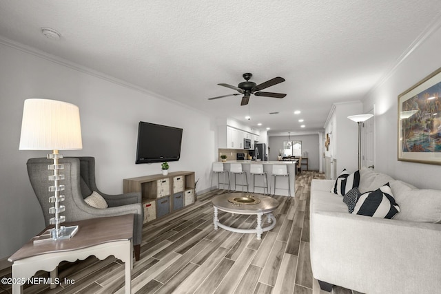 5811 Atlantic Blvd Unit 153, Jacksonville, FL 32207 - living area with ornamental molding, ceiling fan, light wood-style floors, baseboards, and recessed lighting