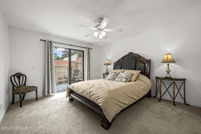 5811 Atlantic Blvd Unit 153, Jacksonville, FL 32207 - bedroom with access to exterior, light colored carpet, baseboards, a textured ceiling, and ceiling fan