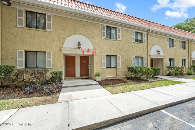 5811 Atlantic Blvd Unit 153, Jacksonville, FL 32207 - townhome / multi-family property with a tiled roof and stucco siding