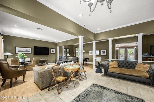 5811 Atlantic Blvd Unit 153, Jacksonville, FL 32207 - living room with decorative columns, ornamental molding, recessed lighting, light tile patterned flooring, and a textured ceiling