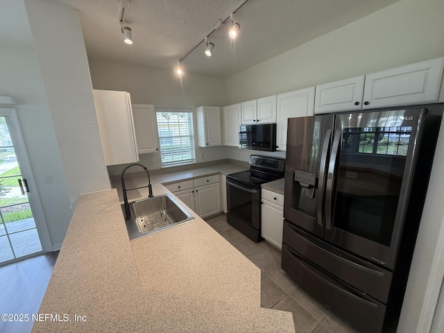 1735 Forest Lake Cir W Unit 2, Jacksonville, FL 32225 - kitchen with black appliances, a sink, track lighting, white cabinets, and light countertops