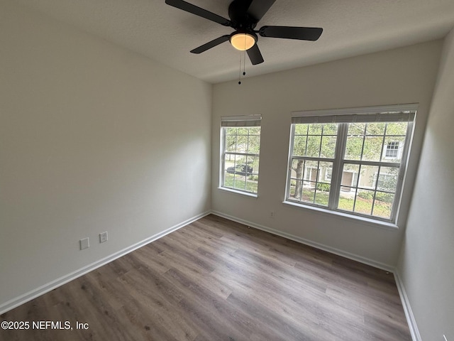 1735 Forest Lake Cir W Unit 2, Jacksonville, FL 32225 - spare room with baseboards, wood finished floors, and ceiling fan
