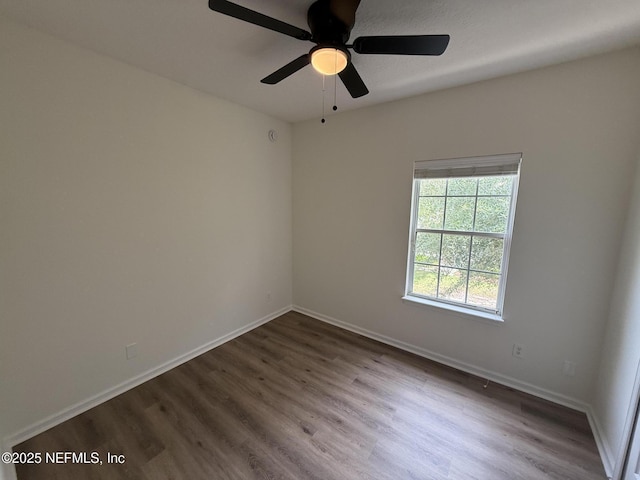 1735 Forest Lake Cir W Unit 2, Jacksonville, FL 32225 - empty room with dark wood-style flooring, baseboards, and a ceiling fan