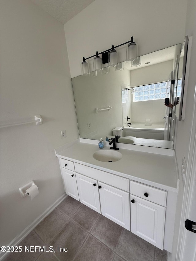 1735 Forest Lake Cir W Unit 2, Jacksonville, FL 32225 - bathroom with vanity, tile patterned flooring, baseboards, toilet, and tub / shower combination