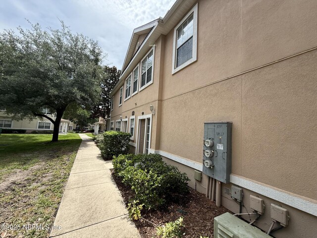 1735 Forest Lake Cir W Unit 2, Jacksonville, FL 32225 - view of property exterior with stucco siding
