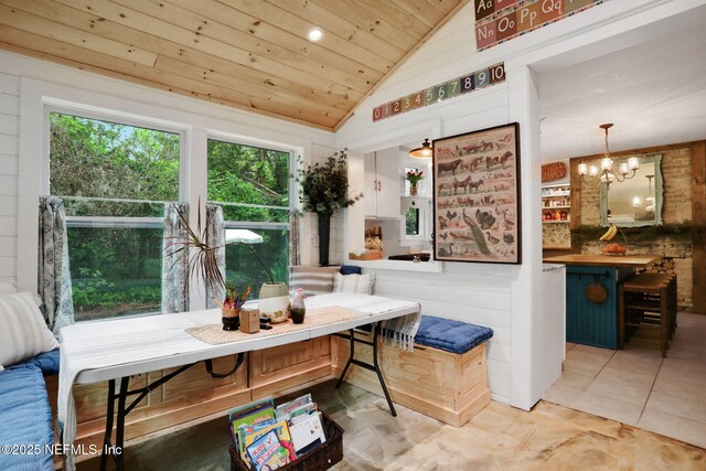 7265 Beach Rd, Elkton, FL 32033 - dining room with plenty of natural light, wooden ceiling, lofted ceiling, a chandelier, and light tile patterned floors