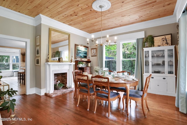 7265 Beach Rd, Elkton, FL 32033 - dining space featuring crown molding, wooden ceiling, healthy amount of natural light, a fireplace with raised hearth, and wood finished floors