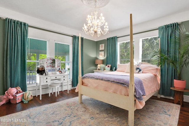 7265 Beach Rd, Elkton, FL 32033 - bedroom with wood finished floors and a chandelier