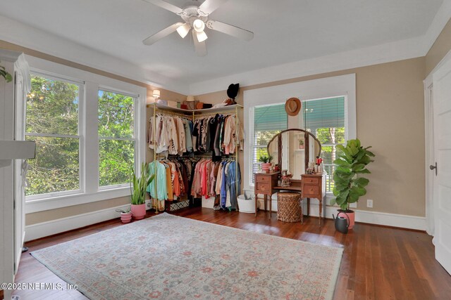 7265 Beach Rd, Elkton, FL 32033 - bedroom featuring baseboards, wood finished floors, and a ceiling fan