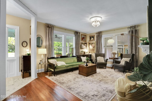 7265 Beach Rd, Elkton, FL 32033 - living area with wood finished floors and a chandelier