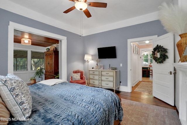 7265 Beach Rd, Elkton, FL 32033 - bedroom featuring wood finished floors, ceiling fan, and baseboards