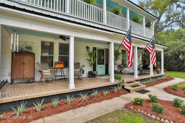 7265 Beach Rd, Elkton, FL 32033 - porch featuring a balcony and a ceiling fan
