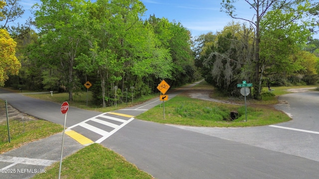 7265 Beach Rd, Elkton, FL 32033 - view of asphalt road with traffic signs