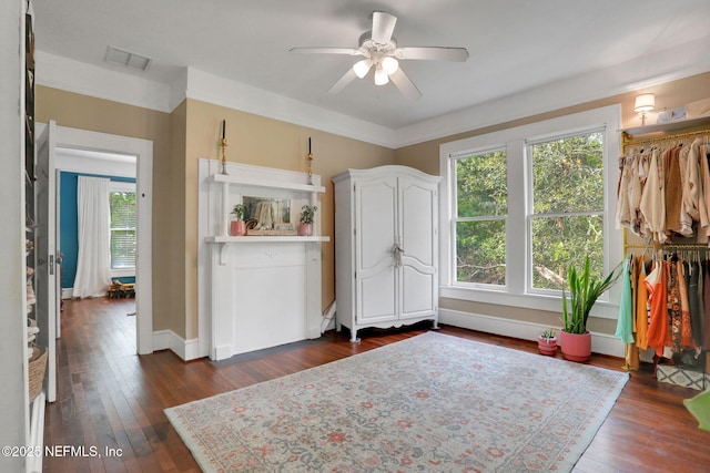 7265 Beach Rd, Elkton, FL 32033 - kitchen featuring a ceiling fan, dark wood finished floors, white cabinets, and baseboards