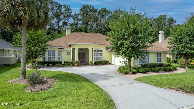 2305 Range Crescent Ct, Fleming Island, FL 32003 - mediterranean / spanish-style home featuring driveway, a chimney, stucco siding, and an attached garage