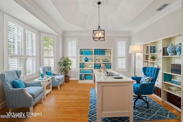 2305 Range Crescent Ct, Fleming Island, FL 32003 - home office with light wood-style floors, a chandelier, a raised ceiling, crown molding, and baseboards