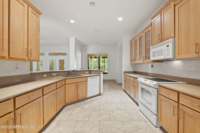 2305 Range Crescent Ct, Fleming Island, FL 32003 - kitchen featuring white appliances, light brown cabinetry, a sink, decorative backsplash, and recessed lighting