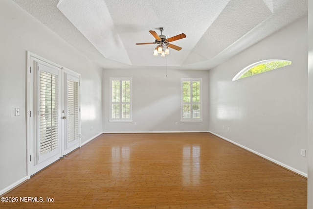 2305 Range Crescent Ct, Fleming Island, FL 32003 - unfurnished room featuring wood finished floors, a textured ceiling, plenty of natural light, ceiling fan, and baseboards
