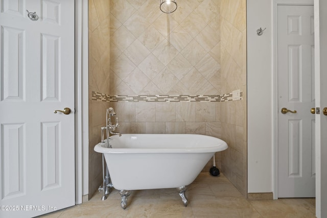 2305 Range Crescent Ct, Fleming Island, FL 32003 - bathroom with a freestanding tub and tile patterned flooring