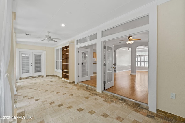 2305 Range Crescent Ct, Fleming Island, FL 32003 - spare room featuring a ceiling fan, arched walkways, french doors, crown molding, and recessed lighting