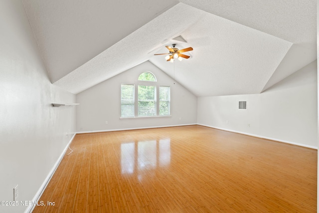 2305 Range Crescent Ct, Fleming Island, FL 32003 - bonus room with a ceiling fan, a textured ceiling, vaulted ceiling, and baseboards