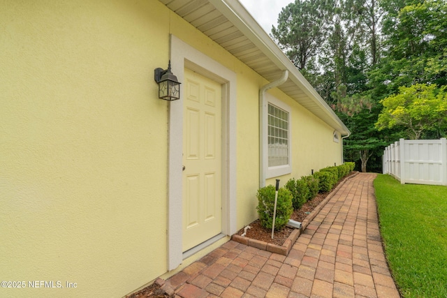2305 Range Crescent Ct, Fleming Island, FL 32003 - view of exterior entry featuring stucco siding